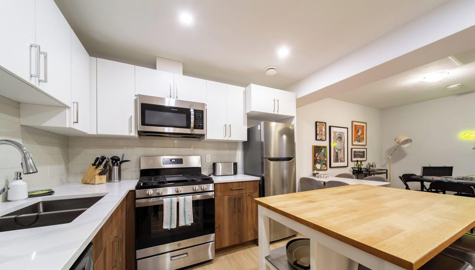 Modern kitchen with stainless appliances and island