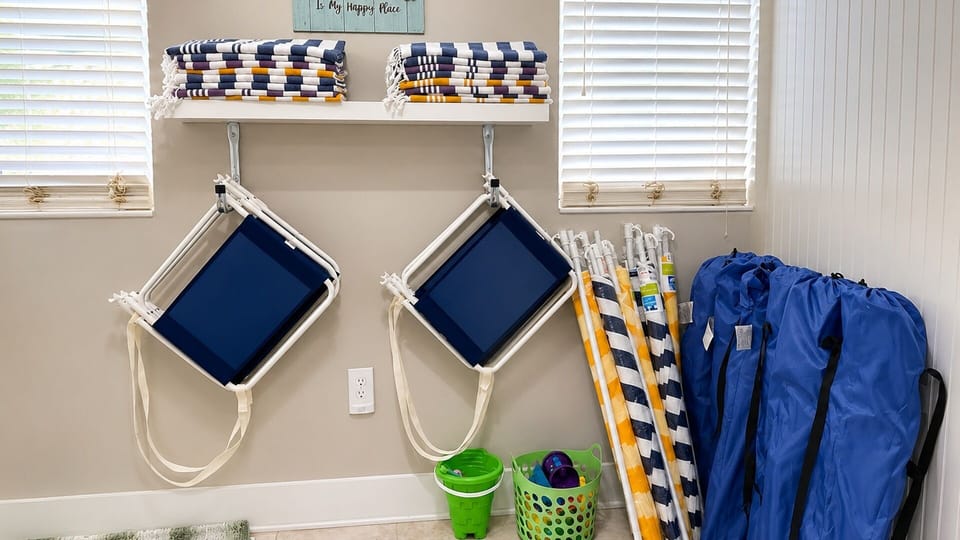 Beach essentials provided, including chairs, umbrellas, a wagon, cooler, and beach toys to make your beach days easy.
