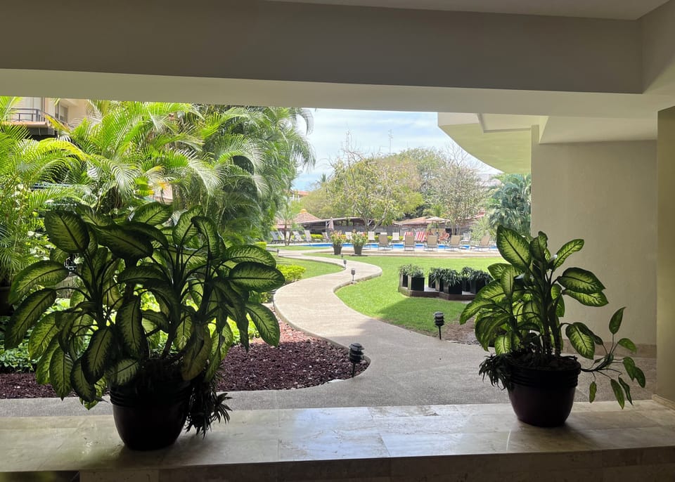 Shared common area near pool. Has tables & chairs, couches, sink and fridge