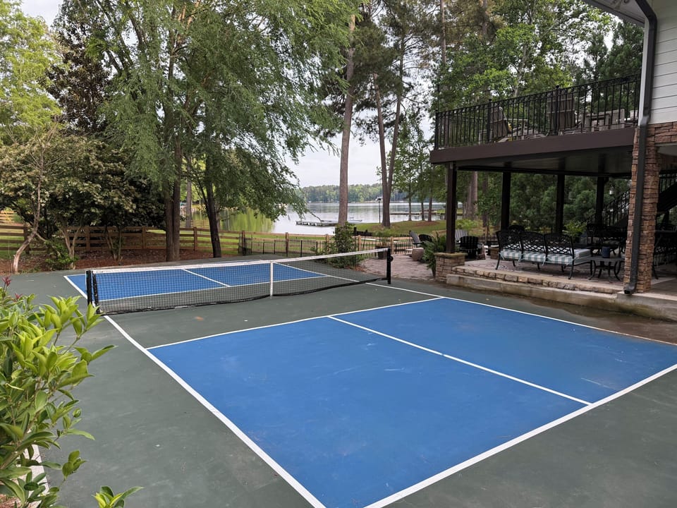 Have a blast with friends & family on the private, lakefront pickleball court!