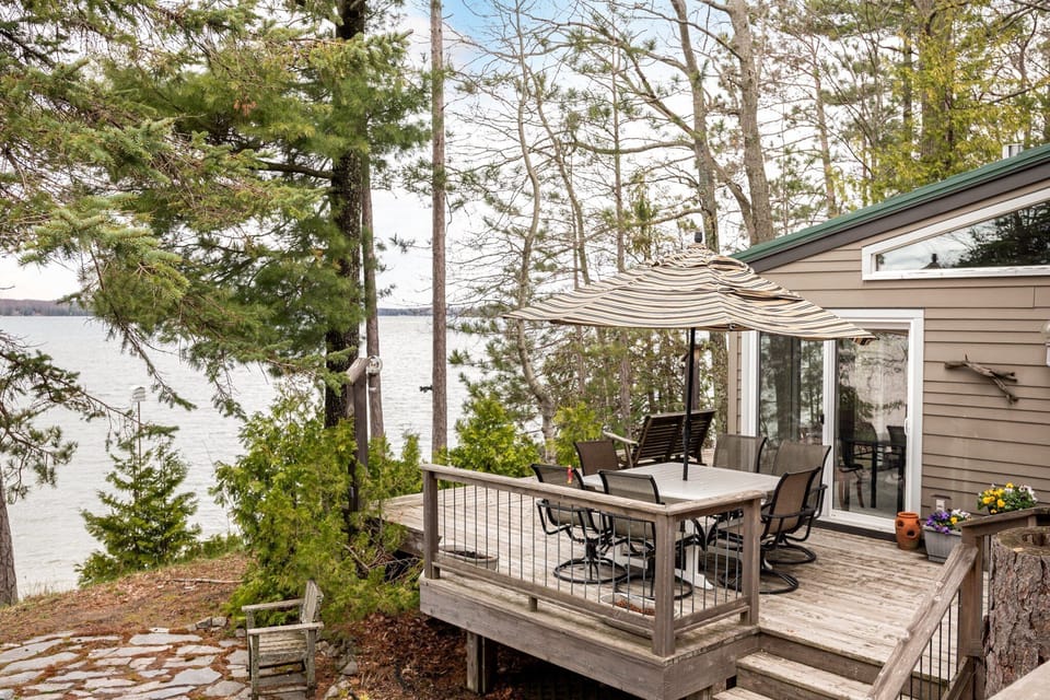 Savor every meal with a view! Our outdoor dining area is perfect for enjoying the lakeside setting. Book your stay today!