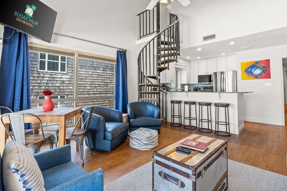 Gather around the breakfast bar, climb the spiral stairs, or dine with a view – this space is made for memories.