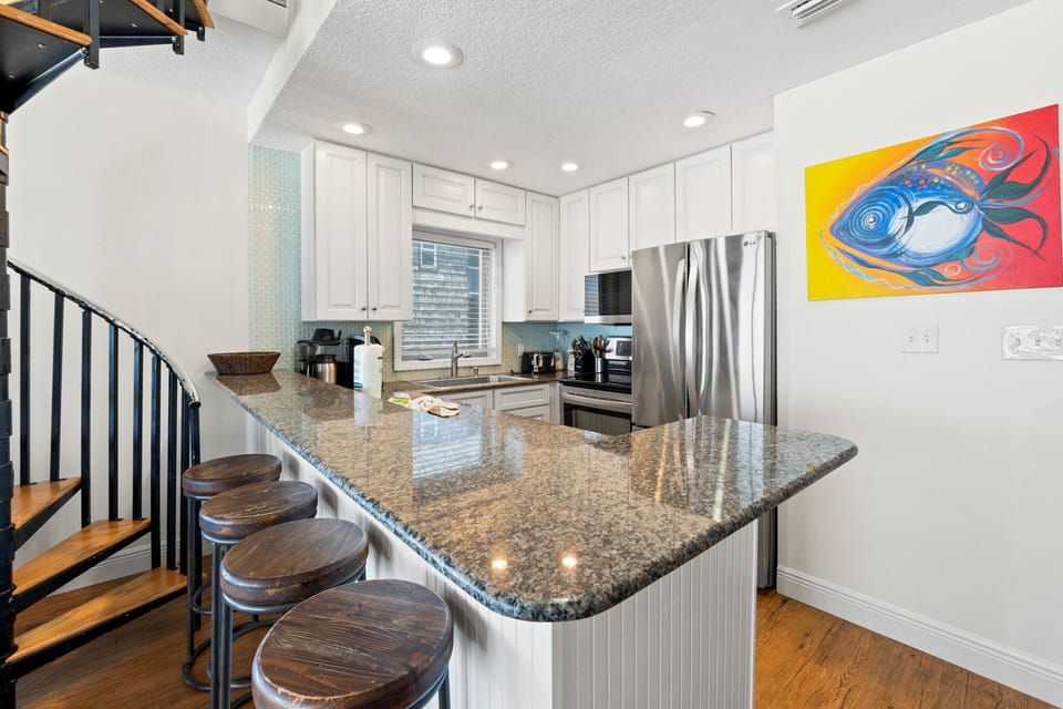 Full kitchen, beachy flair, and plenty of counter space make cooking here feel like a breeze.