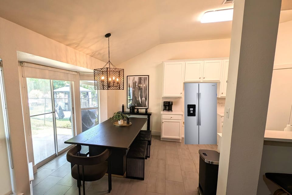Large dining room next to the kitchen. Note that this picture was taken before the new refrigerator was delivered so we edited the picture for now.