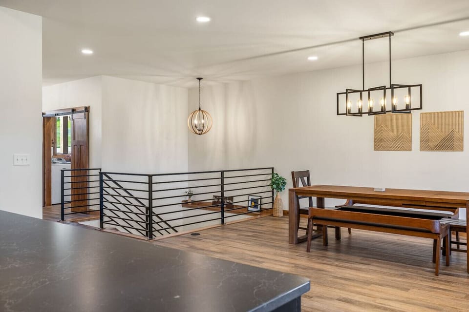 The large windows offer plenty of natural light, creating a bright and airy space, while the open layout ensures everyone feels connected.