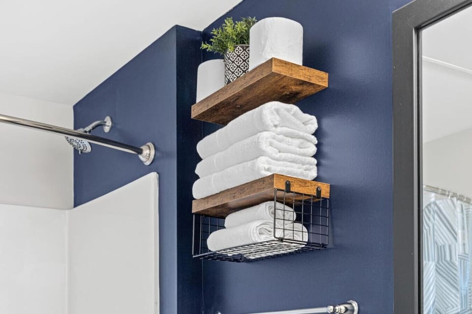The bathroom is designed for comfort, with a spacious shower and elegant fixtures that make every moment feel luxurious.