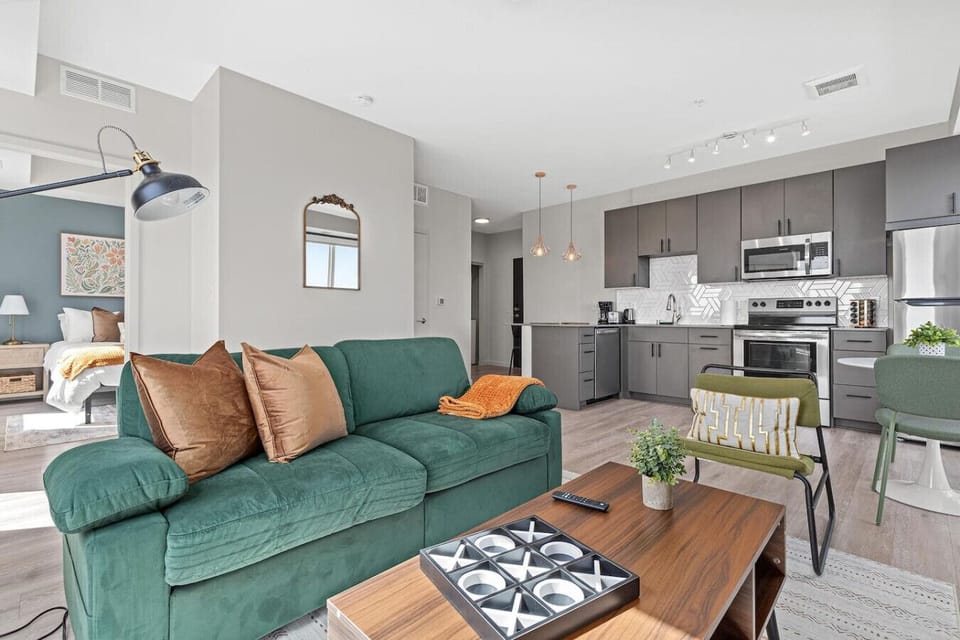 You feel a sense of peace as you step into the living room , with its inviting decor and soothing tones.