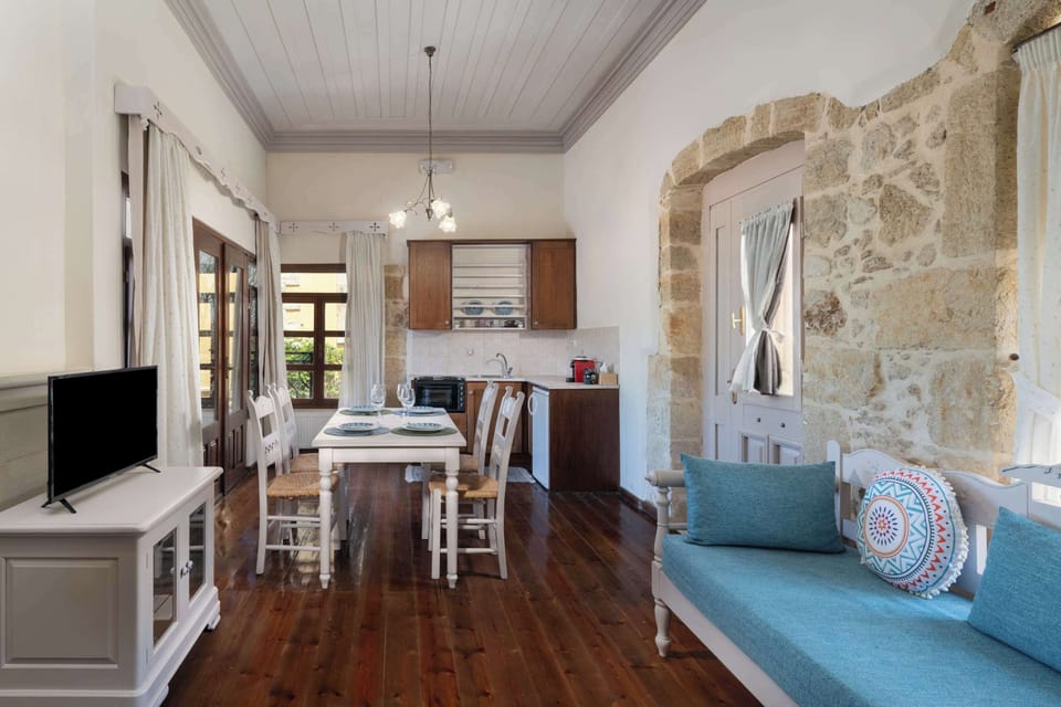 Open-plan space-living room area with adjacent kitchenette