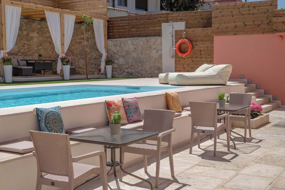 Sitting area by the pool-ideal for a coffee or a drink