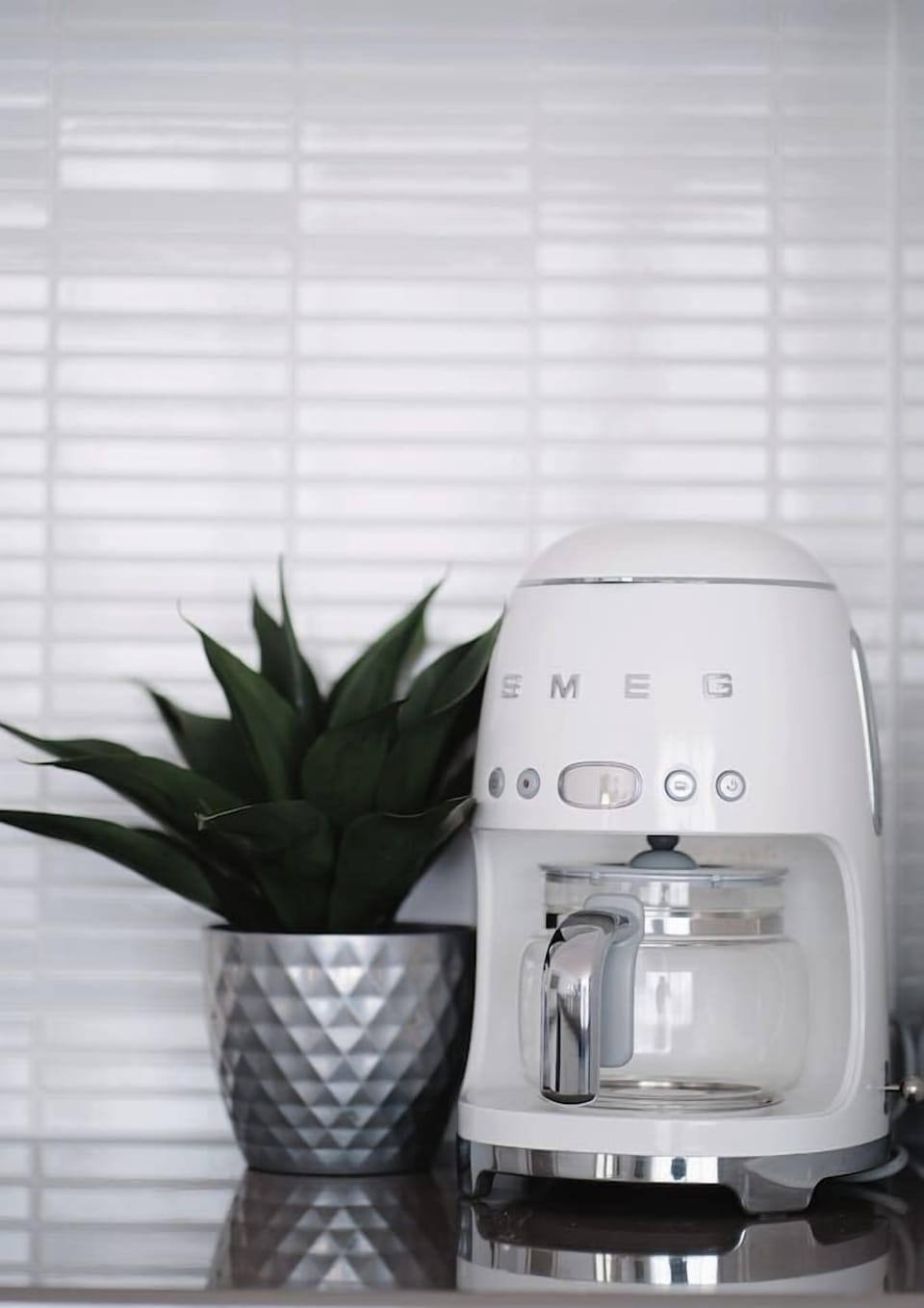 Get your early morning caffeine fix with a SMEG coffee machine on hand. 