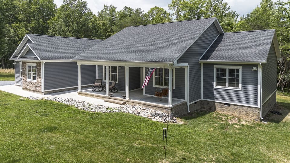Exterior view of the home, featuring a spacious front porch.