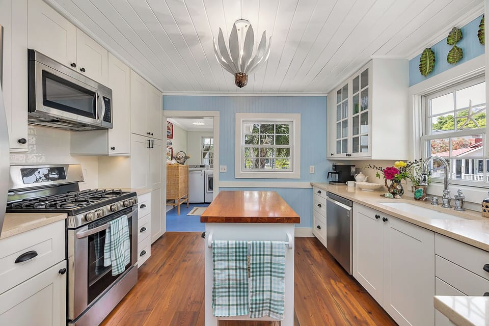 The fully stocked kitchen with a gas stove and oven, microwave and coffee maker