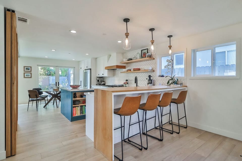 Open kitche with extra counter seating. 