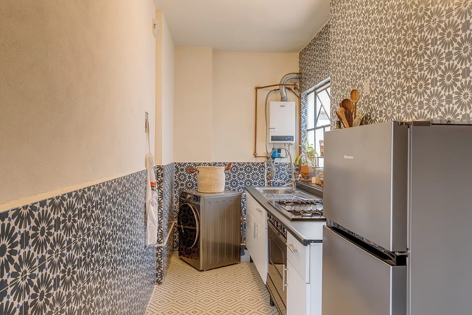 Kitchen with washer & dryer combo.