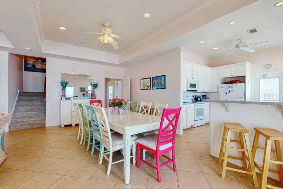 Dinning room with table for 10 plus a kitchen bar for 3.