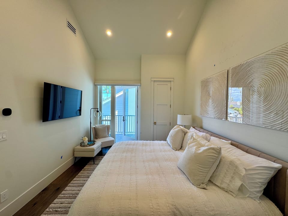 Upstairs master with private deck and walk in closet