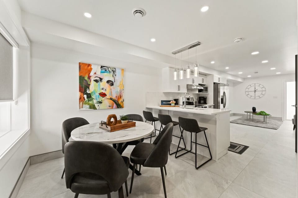 Black modern chairs add contrast and sophistication.