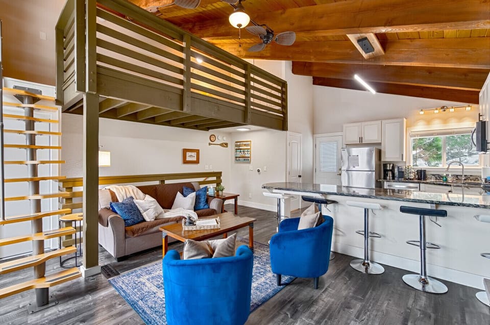 Open-concept living with vaulted ceilings and a full kitchen for group meals.