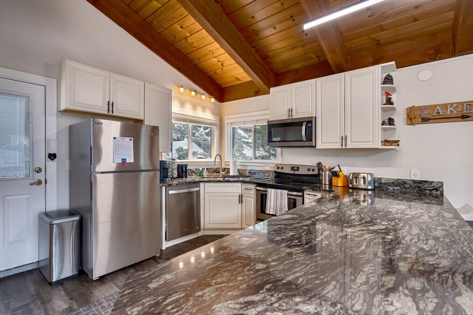 Fully stocked kitchen with modern appliances and plenty of space to cook and gather.