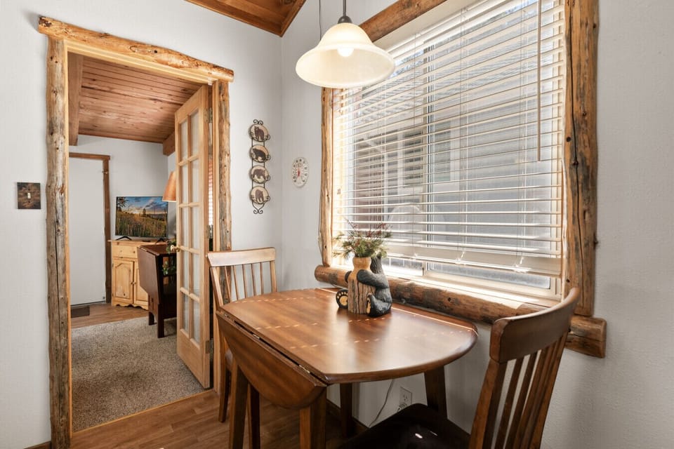 Intimate dining nook by the window, perfect for slow meals & morning coffee.