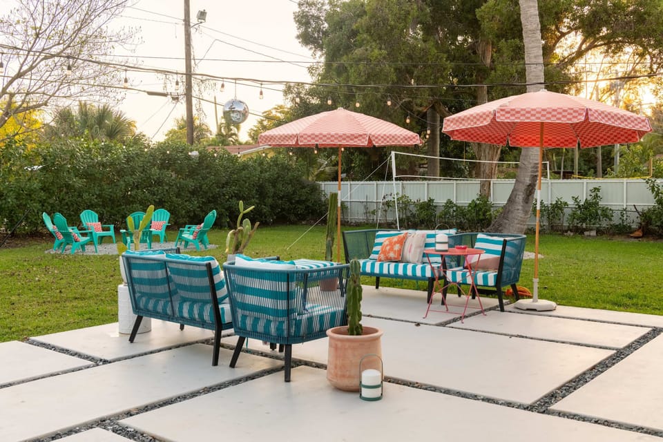 Welcome to your backyard paradise—seating for everyone and a volleyball court for endless fun!
