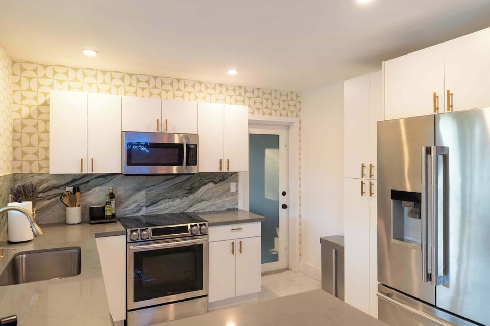 Enjoy the convenience of a home-cooked meal with our spacious, fully equipped kitchen featuring modern appliances and all the essentials.