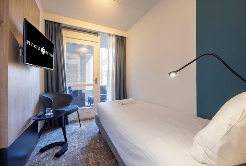 Unit with 2 single beds and 1 sofa bed. Exact unit will be assigned upon arrival. Views, colors, and decor may vary.