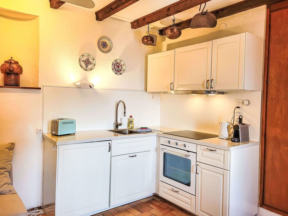 Kitchen, Cabinetry, Furniture, Countertop, Kitchen Appliance, Interior Design, Wood, Flooring, Major Appliance, Cupboard