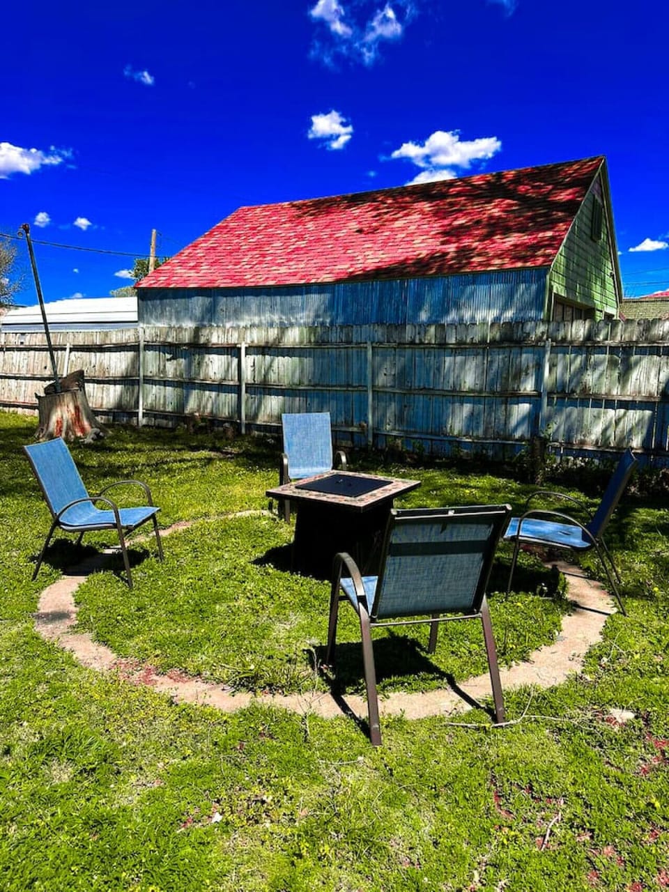 Private backyard fire pit with outdoor seating, perfect for relaxing nights under the stars