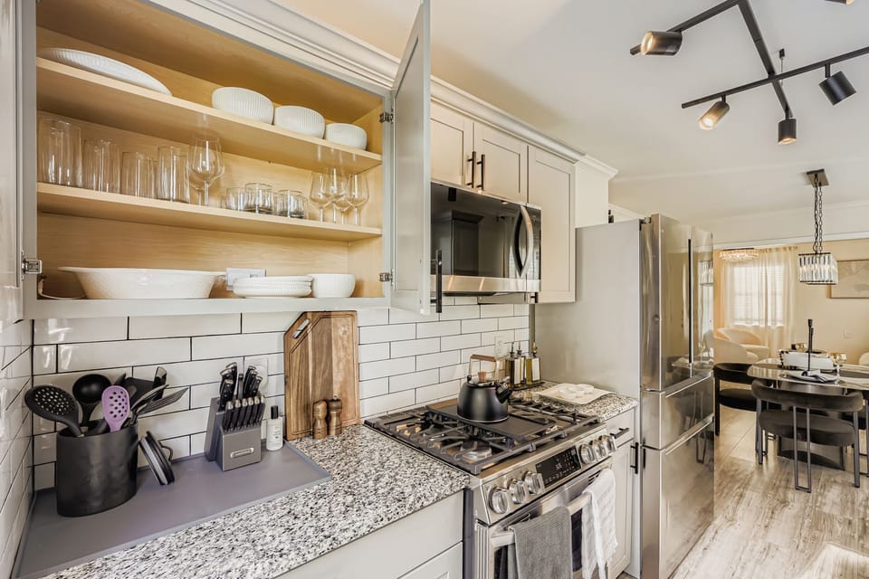 Modern, sleek, and fully stocked. Cook like home in a stylish gourmet kitchen.