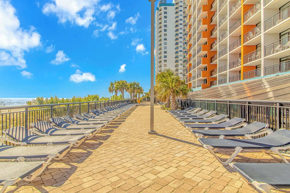 Soak up the sunshine and relax by the oceanfront on our spacious sun deck lined with comfortable loungers. Enjoy spectacular views and gentle ocean breezes in Myrtle Beach!