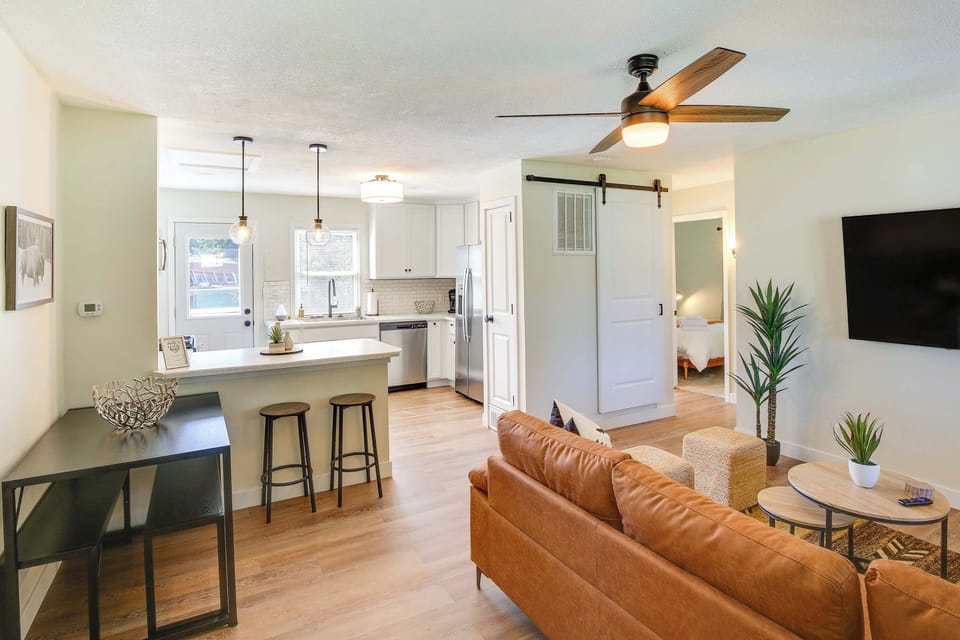 Upon entering, you'll be welcomed by an elegantly designed open-concept space that seamlessly blends a sophisticated living room