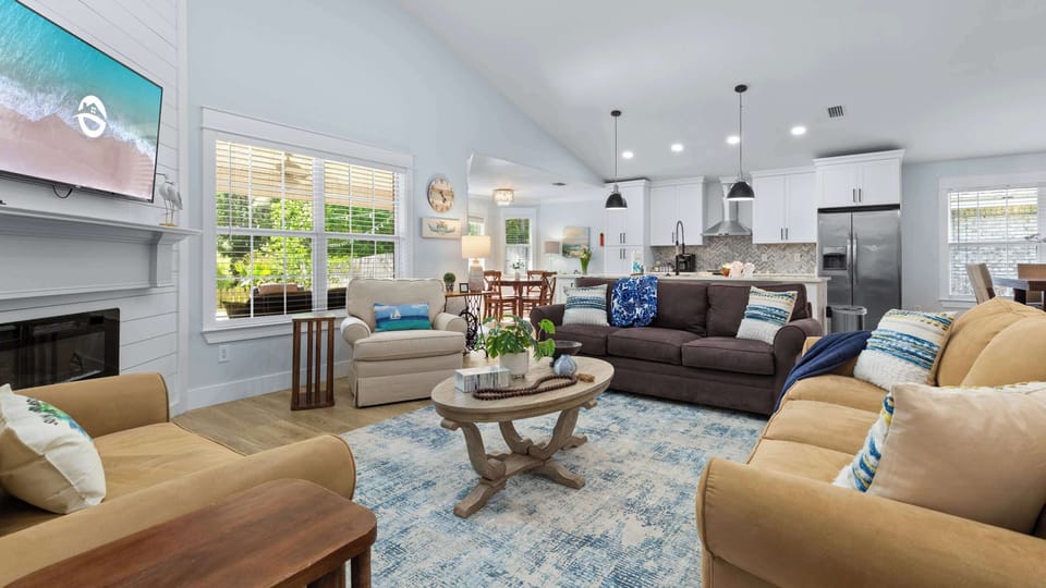 The seating area opens right up to the kitchen + two separate dining areas. 