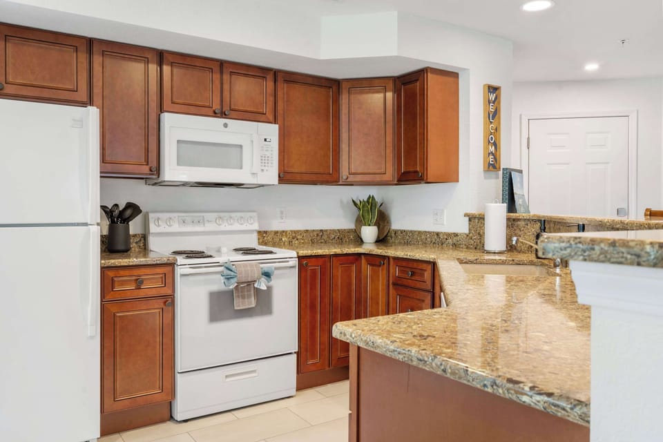 The open kitchen offers ample space & all the comforts of home