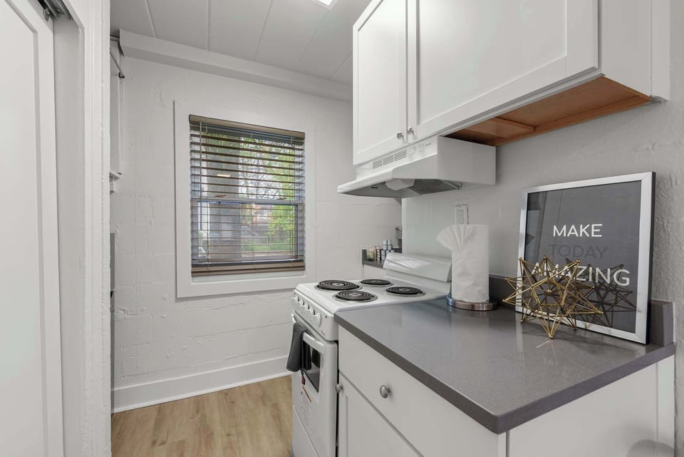 The sleek kitchen offers ample storage & every home comfort