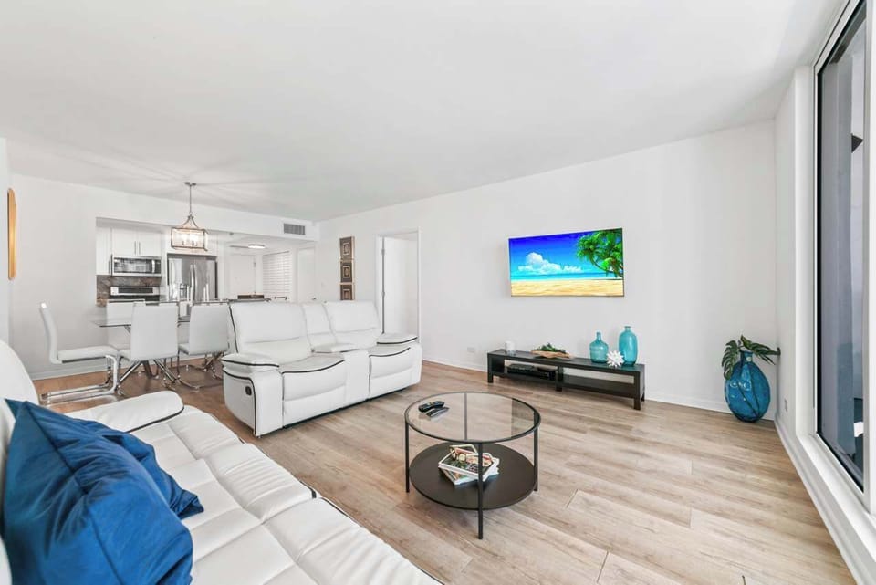 Bight living area with sofa sleeper and TV