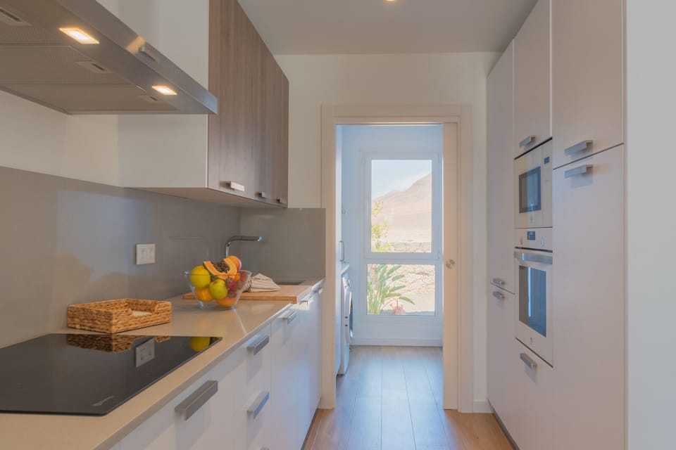 Fully equipped American kitchen. Open-plan living/dining room with separate full bathroom.
