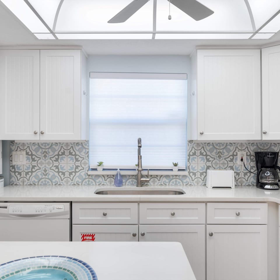 The open, airy kitchen offers ample space & all the comforts of home