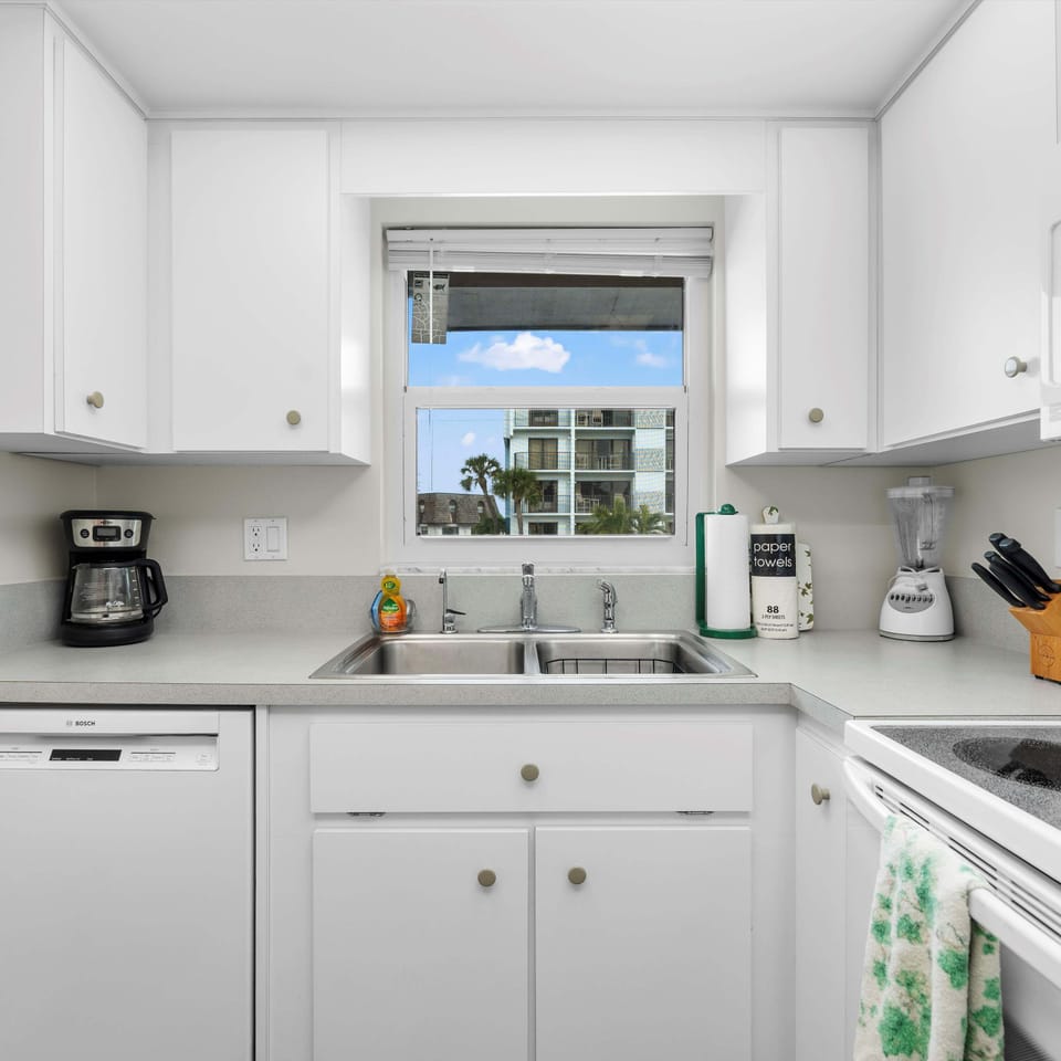 The sunny kitchen offers ample space & all the comforts of home