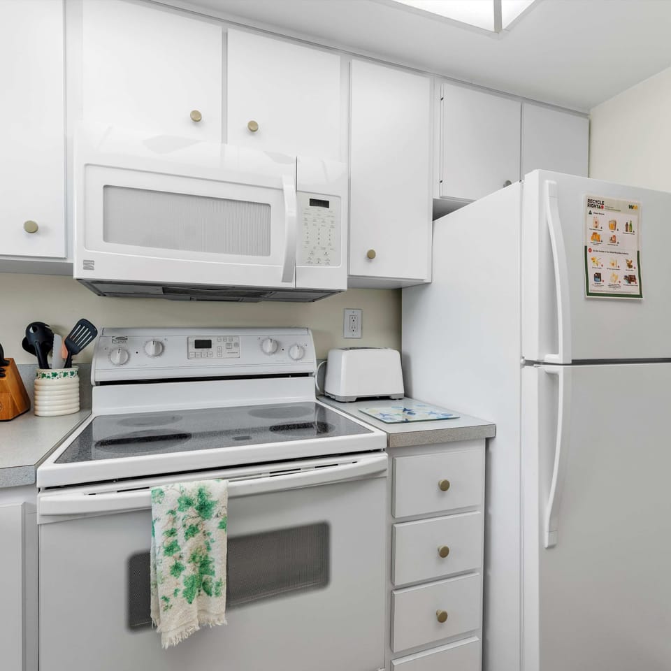The sunny kitchen offers ample space & all the comforts of home
