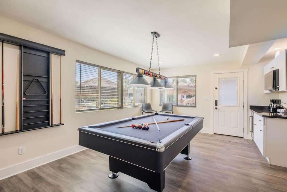 Game room with pool table, kitchenette and access to the outdoor patio