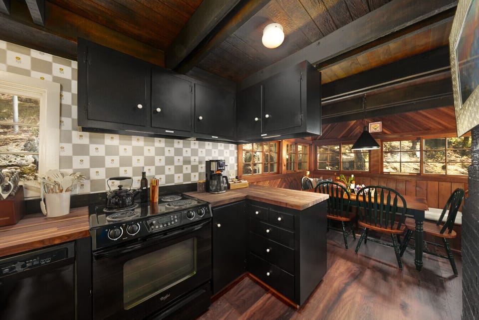 Charming kitchen with mountain views and a cozy dining nook