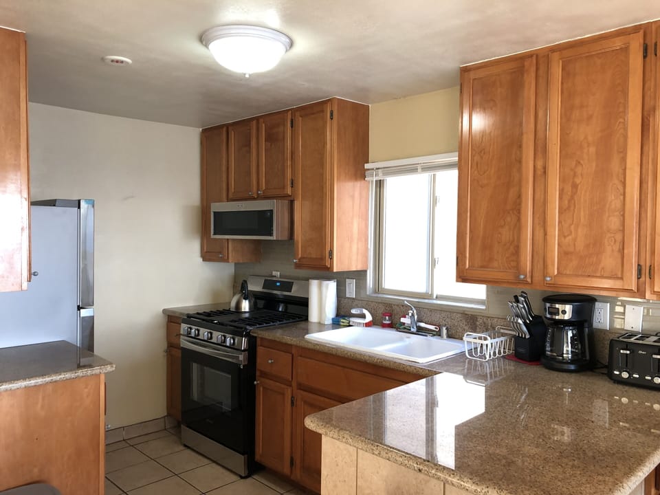 Beautiful kitchen in wood, granite and stainless steel