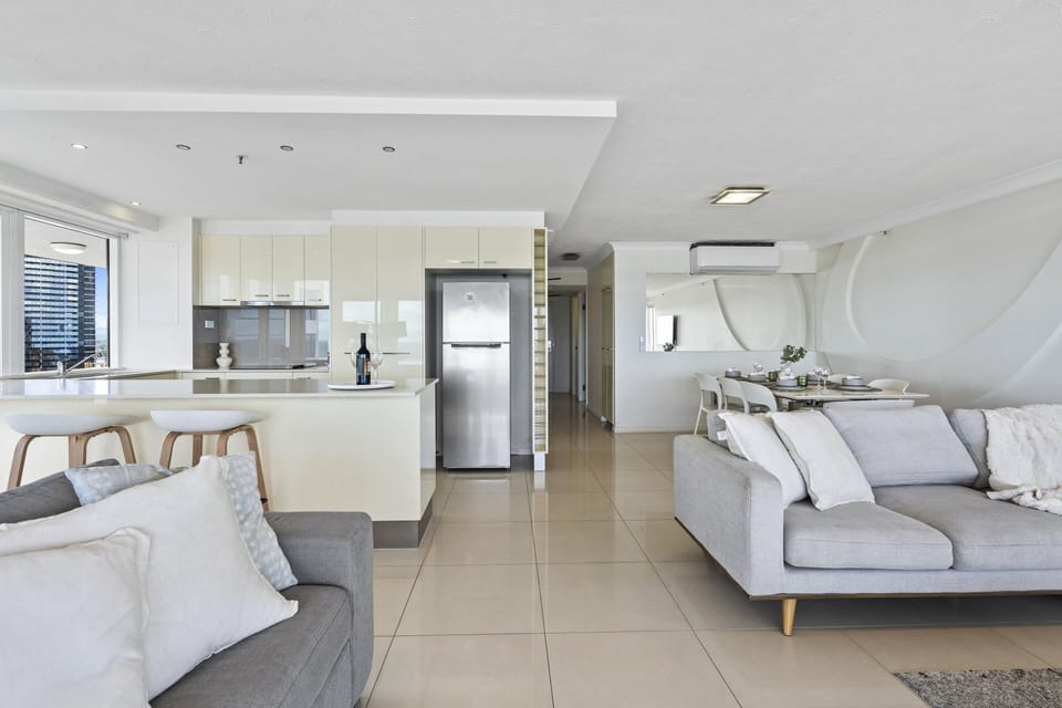 Living area is right next to the fully equipped kitchen