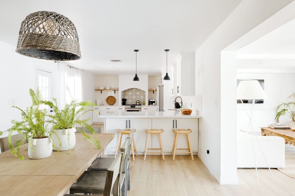 Fully stocked kitchen with stainless steel appliances and island seating