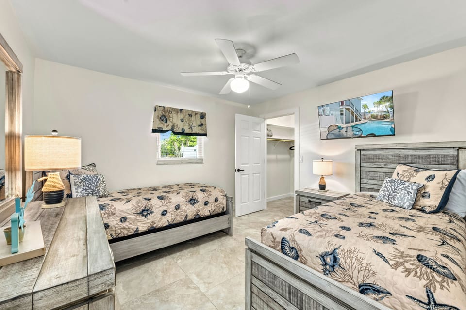 The twin bedroom with fun coastal accents and room for kids or friends.