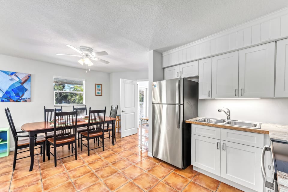Holmes Hideaway, gather around the dining table with friends and family, where every meal feels like a special occasion.