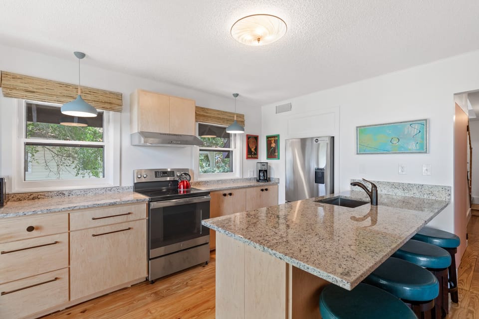 The kitchen in the home boasts a four person breakfast bar and updated appliances.