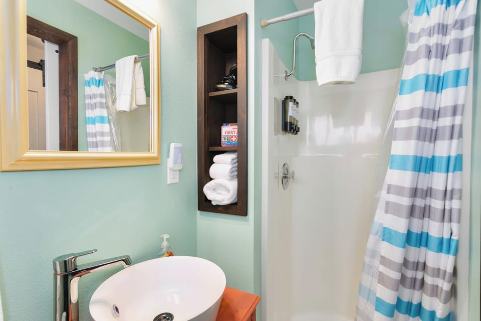 Fresh, clean bathroom stocked with towels and essentials