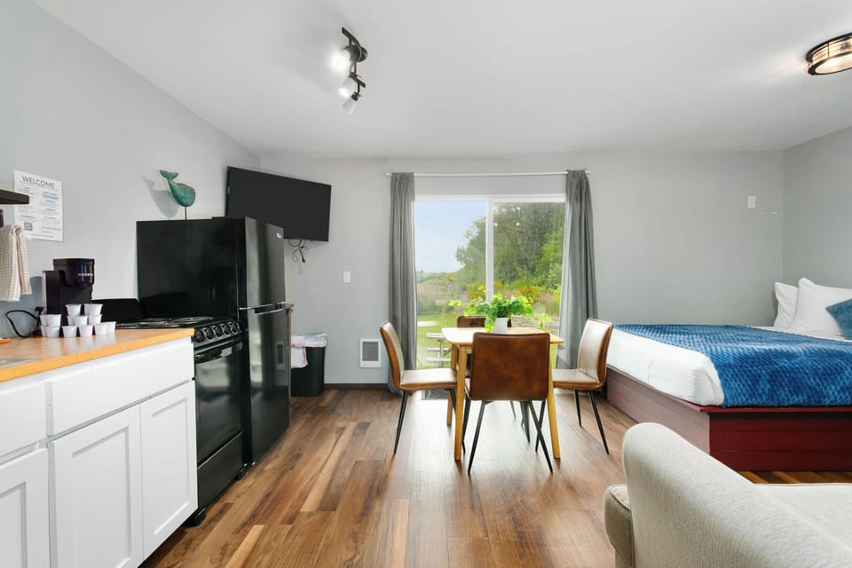 Open layout connecting kitchen, dining, and sleeping spaces
